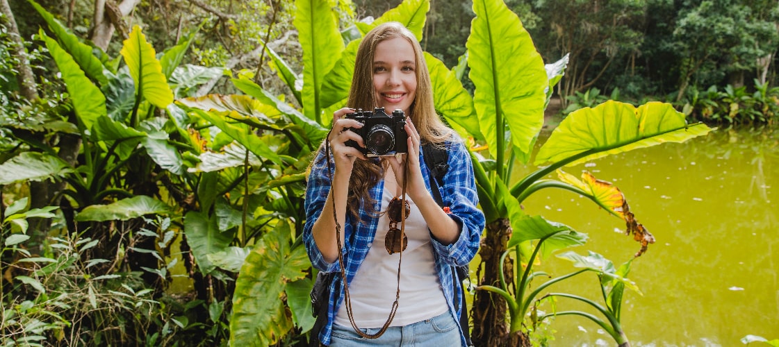 girl-with-camera-jungle-min